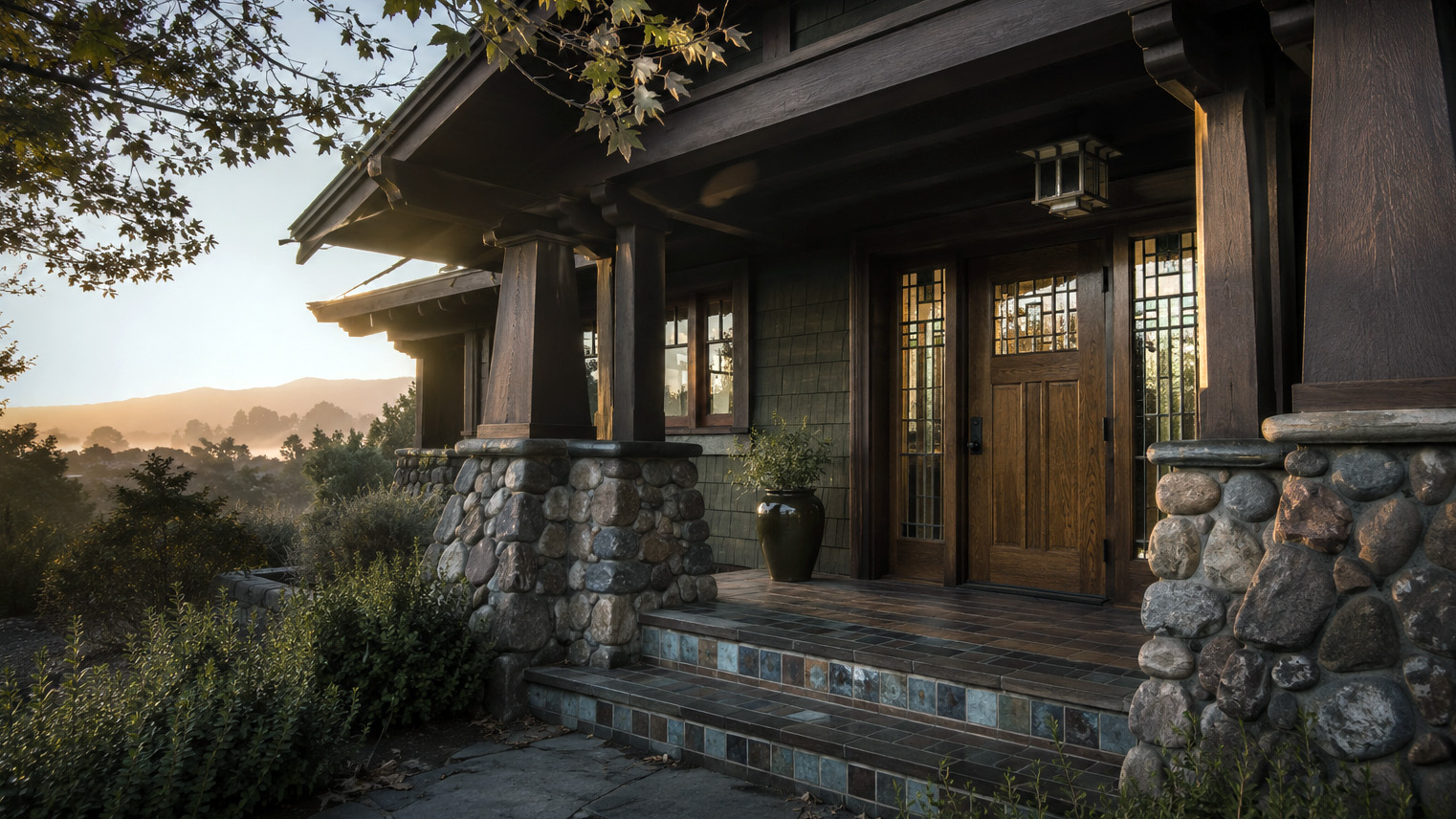 Craftsman bungalow porch with tapered columns, river stone piers, and leaded art glass in the San Gabriel Valley foothills.