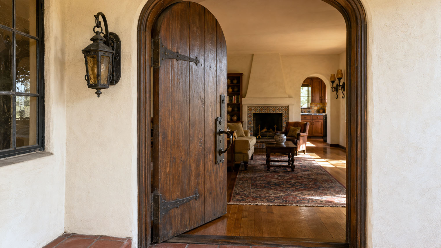 The view through the open arched door of a Spanish Colonial Revival home. AI generated image by Greg Anderson.